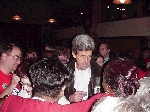 John Kerry providing an autograph